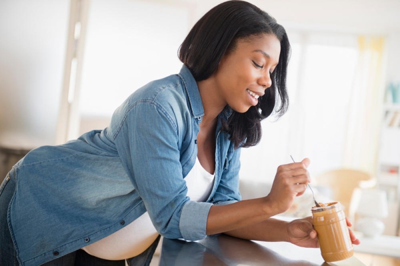 b2ap3 large pregnant woman eating peanut butter