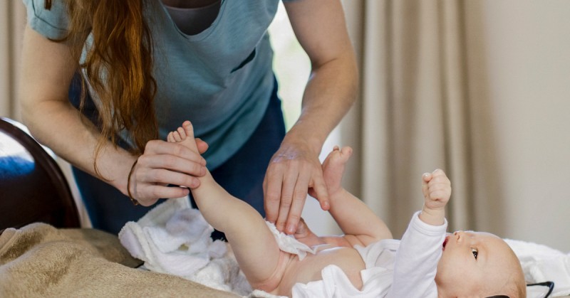b2ap3 large Woman changing diaper 1200x628 facebook